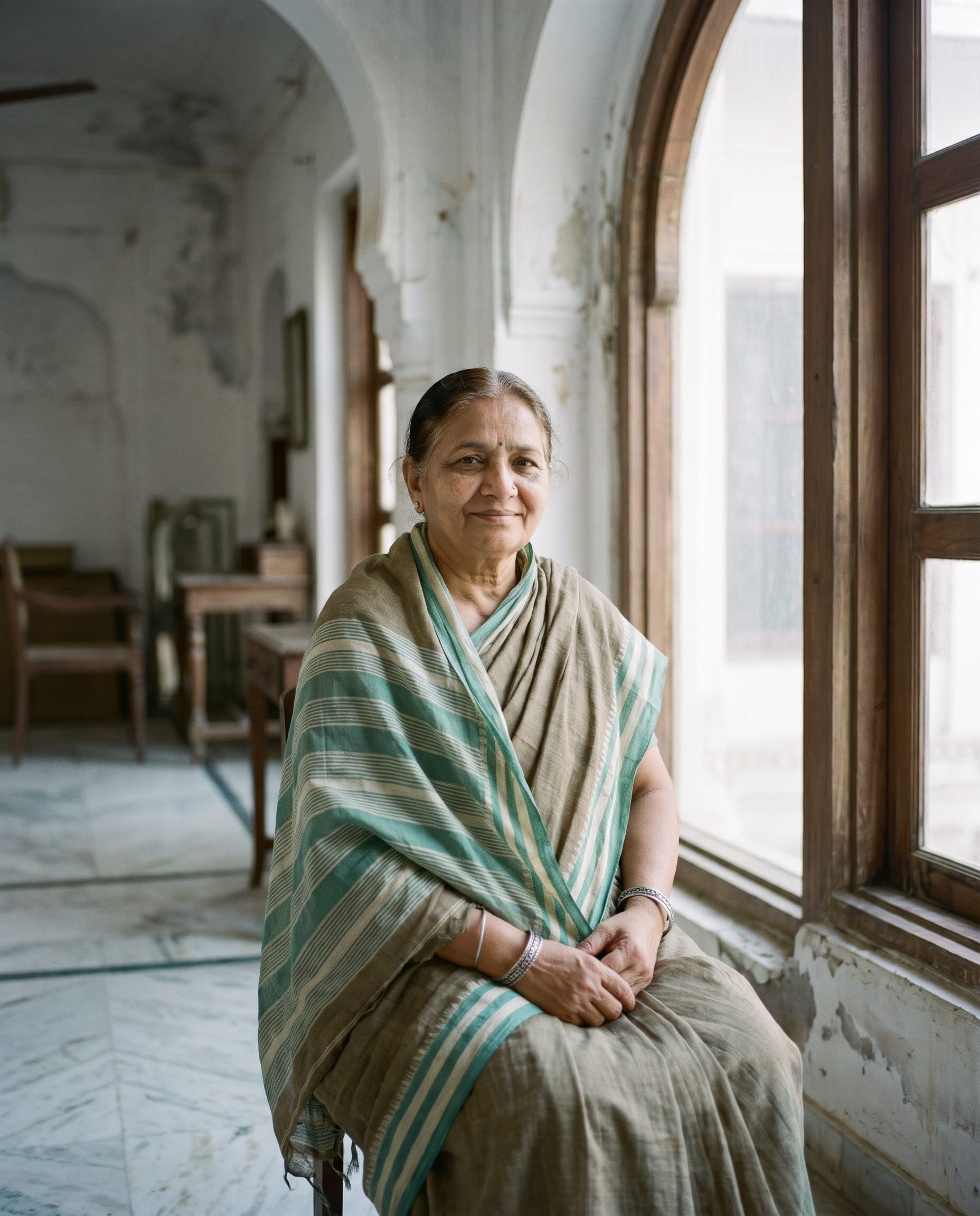 Portrait of a woman in a cotton saree in soft window light